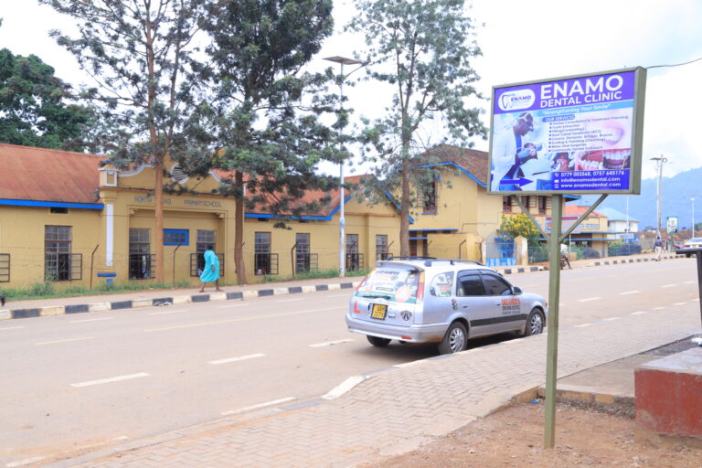Enamo Dental Clinic signpost opposite North Road Primary School in Mbale